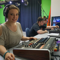 students working at the sound board